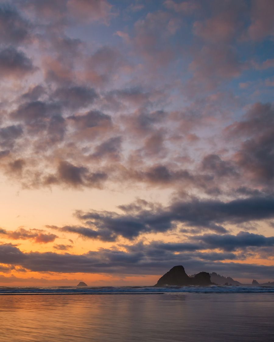 images of rocks in ocean at sunset